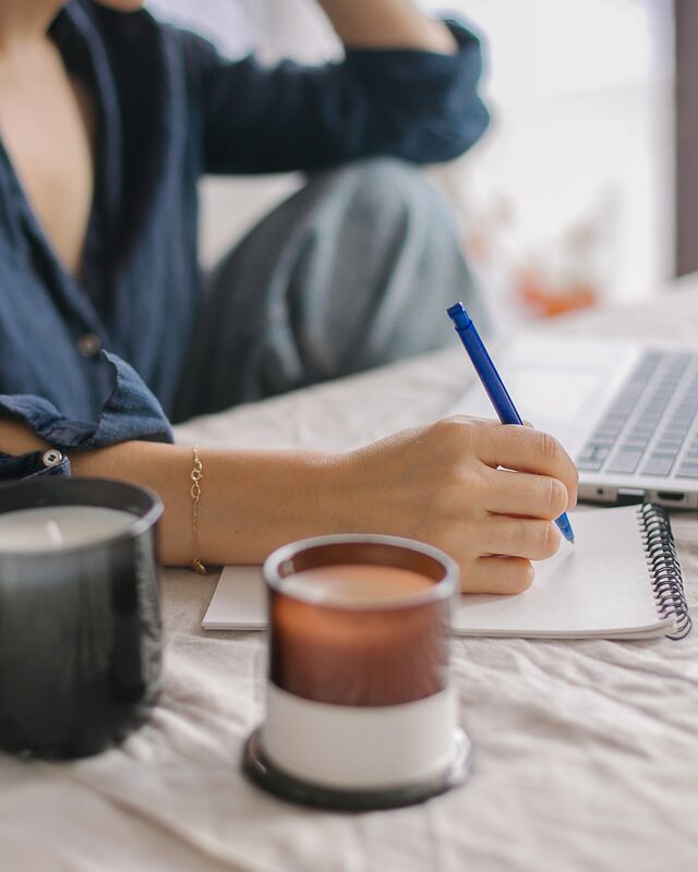 Founder taking notes to plan a B2B podcast launch roadmap
