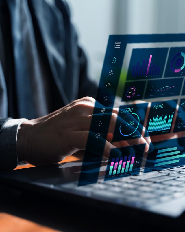 IT and HR professional reviewing an AI dashboard on a laptop